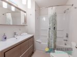 Full bathroom with a shower and a bathtub near the Queen bedroom.